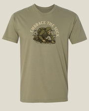 Ranger green t-shirt with graphic design of skeleton in uniform crawling under barbed wire through the mud with text 'Embrace the Suck'