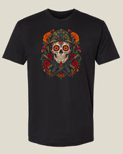 Black Muertos T-Shirt with a decorated skull, military helmet, rifles, roses, and marigolds.