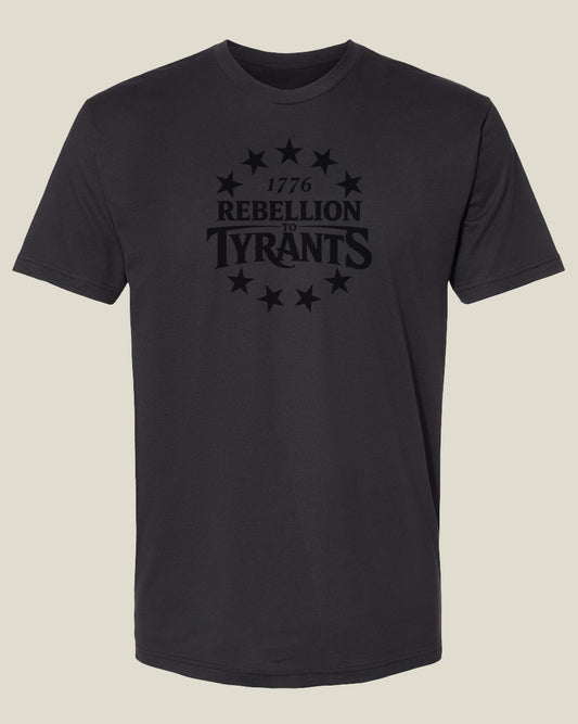 Graphite black cotton t-shirt with '1776 Rebellion to Tyrants' text and 13 star design 