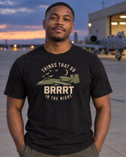 Man wearing the black Things That Go Brrrt T-Shirt in a realistic aviation lifestyle scene.